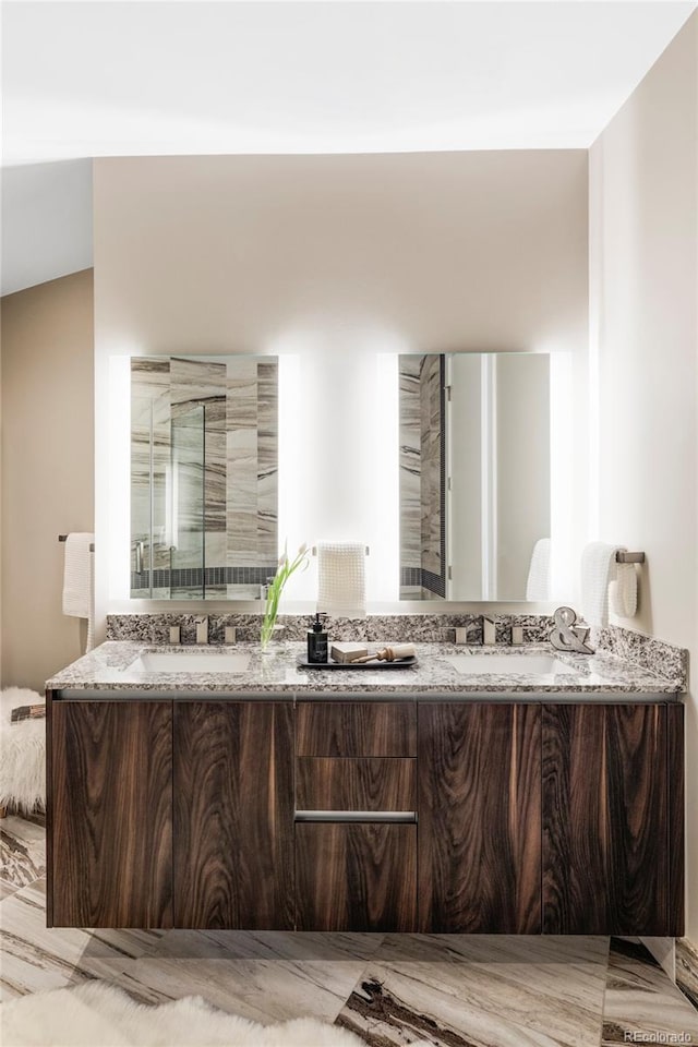 bathroom featuring double vanity and a sink