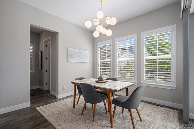 9380 Bear River St, Littleton, CO 80125 - dining space featuring baseboards, a chandelier, and wood finished floors