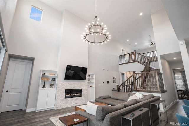 9380 Bear River St, Littleton, CO 80125 - living room featuring a high ceiling, dark wood finished floors, stairs, baseboards, and a ceiling fan