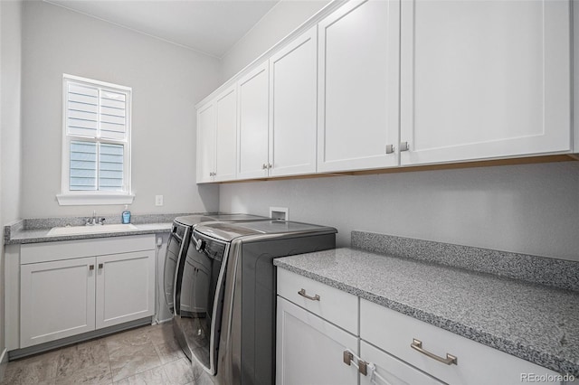 9380 Bear River St, Littleton, CO 80125 - laundry room featuring cabinet space, washer and clothes dryer, and light marble finish floors
