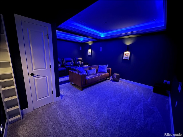 9380 Bear River St, Littleton, CO 80125 - carpeted cinema featuring a tray ceiling and baseboards