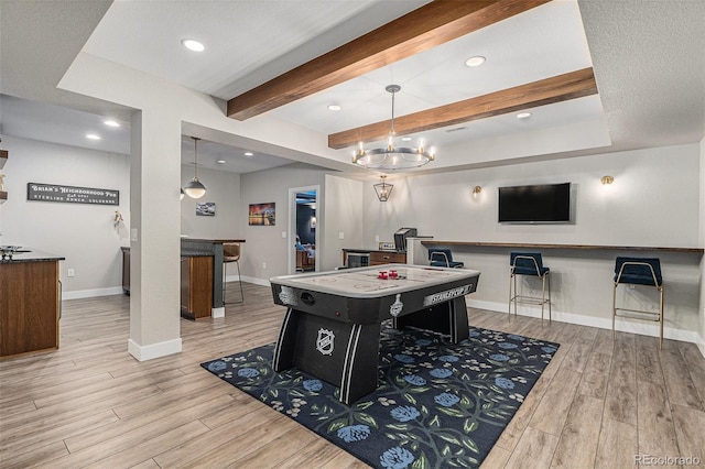 9380 Bear River St, Littleton, CO 80125 - recreation room featuring wood finished floors, baseboards, beamed ceiling, recessed lighting, and bar area