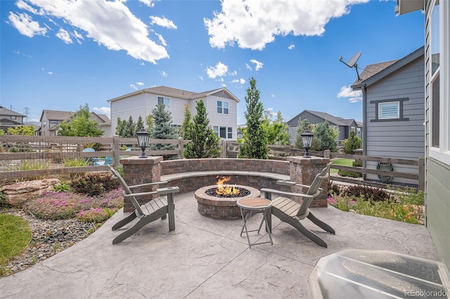 9380 Bear River St, Littleton, CO 80125 - view of patio / terrace featuring an outdoor fire pit and a residential view