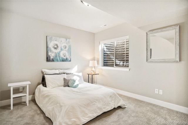 bedroom with baseboards and carpet floors