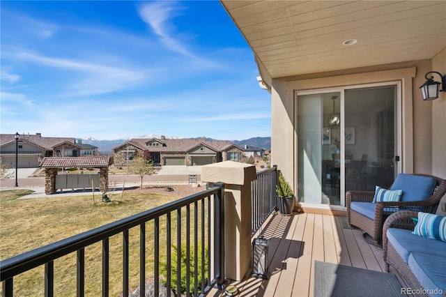 balcony with a residential view and a mountain view