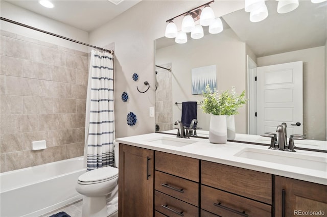 full bathroom featuring shower / tub combo with curtain, toilet, and double vanity