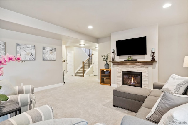 living room with stairs, light carpet, baseboards, a fireplace, and recessed lighting