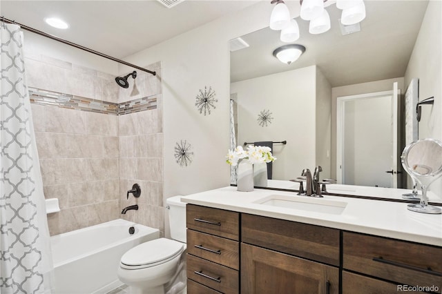 full bath featuring shower / bath combo with shower curtain, toilet, and vanity