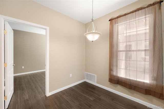 4064 S Carson St Unit 101, Aurora, CO 80014 - unfurnished room with dark wood-style floors, plenty of natural light, and lofted ceiling