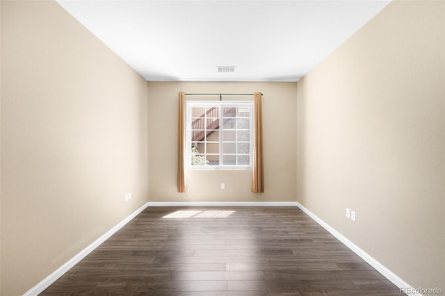 4064 S Carson St Unit 101, Aurora, CO 80014 - empty room featuring dark wood-style floors and baseboards
