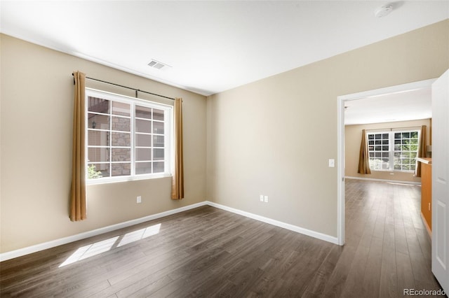 4064 S Carson St Unit 101, Aurora, CO 80014 - unfurnished room with a smoke detector and dark wood finished floors