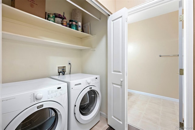 4064 S Carson St Unit 101, Aurora, CO 80014 - washroom featuring separate washer and dryer and baseboards