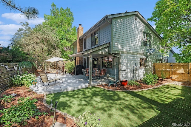 8002 Field Ct, Arvada, CO 80005 - rear view of property featuring a chimney and a patio area