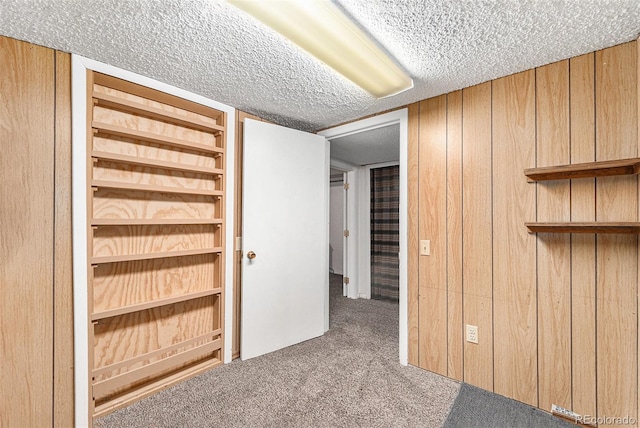 8002 Field Ct, Arvada, CO 80005 - finished basement featuring carpet, a textured ceiling, and wood walls