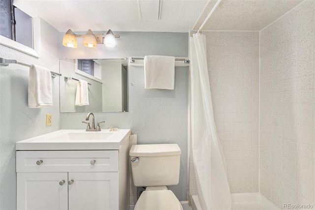 8002 Field Ct, Arvada, CO 80005 - full bath featuring a textured wall, vanity, and a tile shower