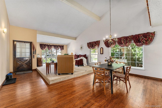 8002 Field Ct, Arvada, CO 80005 - dining room with wood finished floors, plenty of natural light, and a chandelier