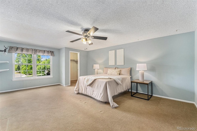 8002 Field Ct, Arvada, CO 80005 - bedroom featuring carpet, a textured ceiling, a ceiling fan, and a spacious closet