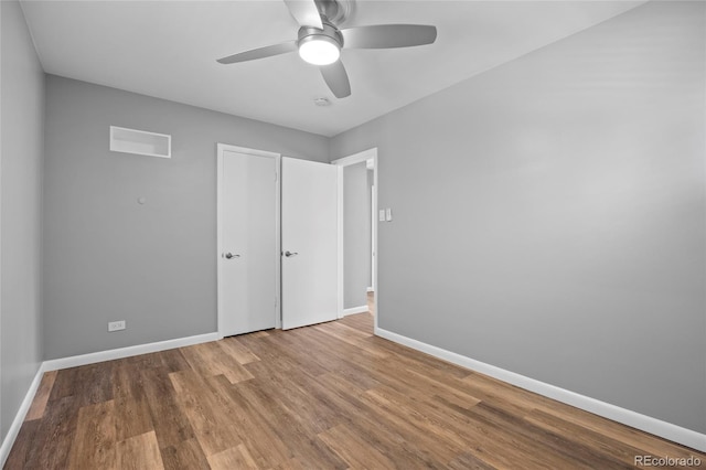 2582 S Uno Way, Denver, CO 80219 - unfurnished bedroom featuring wood finished floors and ceiling fan