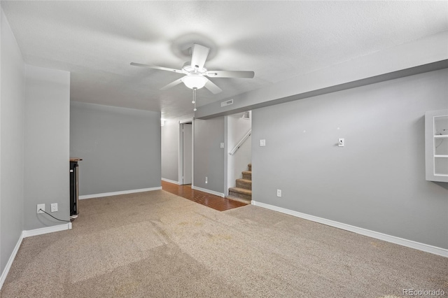 2582 S Uno Way, Denver, CO 80219 - carpeted spare room featuring a ceiling fan and stairway