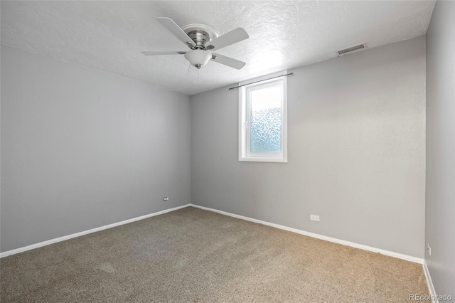 2582 S Uno Way, Denver, CO 80219 - unfurnished room with ceiling fan, carpet, and a textured ceiling