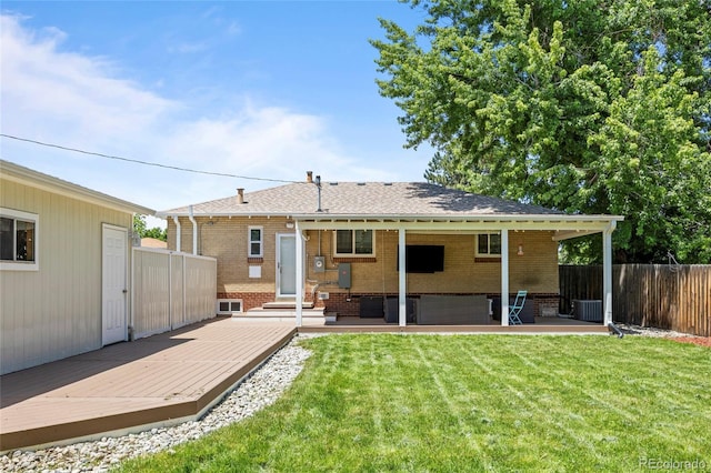 2582 S Uno Way, Denver, CO 80219 - rear view of property featuring brick siding, a deck, a shingled roof, and entry steps