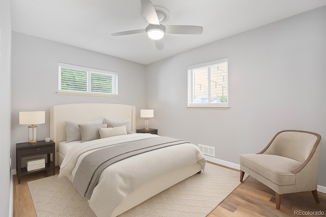2582 S Uno Way, Denver, CO 80219 - bedroom featuring wood finished floors and a ceiling fan