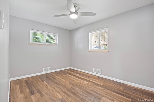 2582 S Uno Way, Denver, CO 80219 - empty room with wood finished floors and a ceiling fan