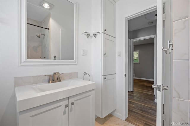 2582 S Uno Way, Denver, CO 80219 - bathroom with vanity and baseboards
