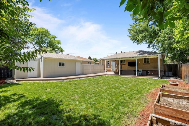 2582 S Uno Way, Denver, CO 80219 - fenced backyard with a garden and a patio