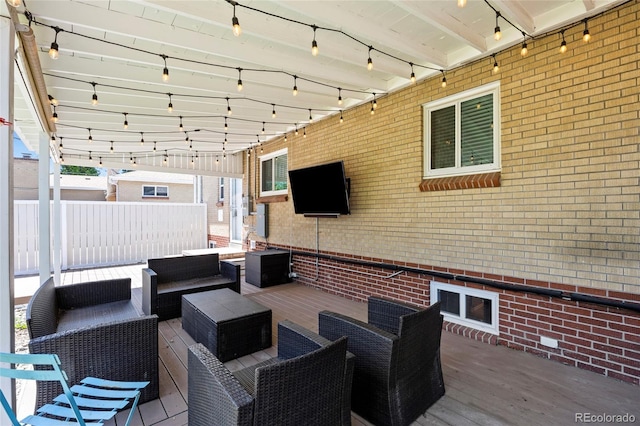 2582 S Uno Way, Denver, CO 80219 - wooden terrace with an outdoor living space