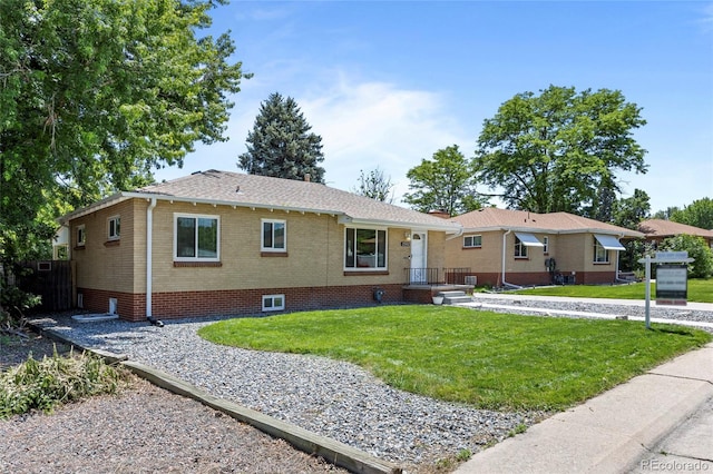 2582 S Uno Way, Denver, CO 80219 - view of front of property featuring a front yard and brick siding