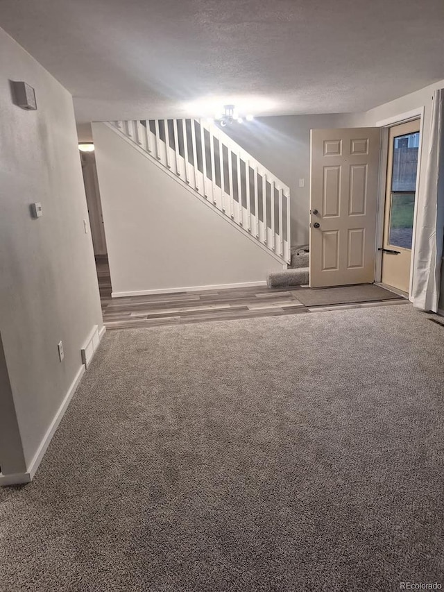 6207 W 92nd Pl, Westminster, CO 80031 - unfurnished living room with stairway and carpet floors