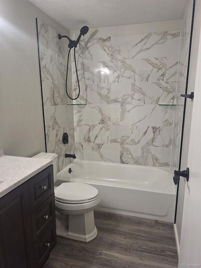 6207 W 92nd Pl, Westminster, CO 80031 - bathroom featuring vanity, bathtub / shower combination, a textured ceiling, and wood finished floors
