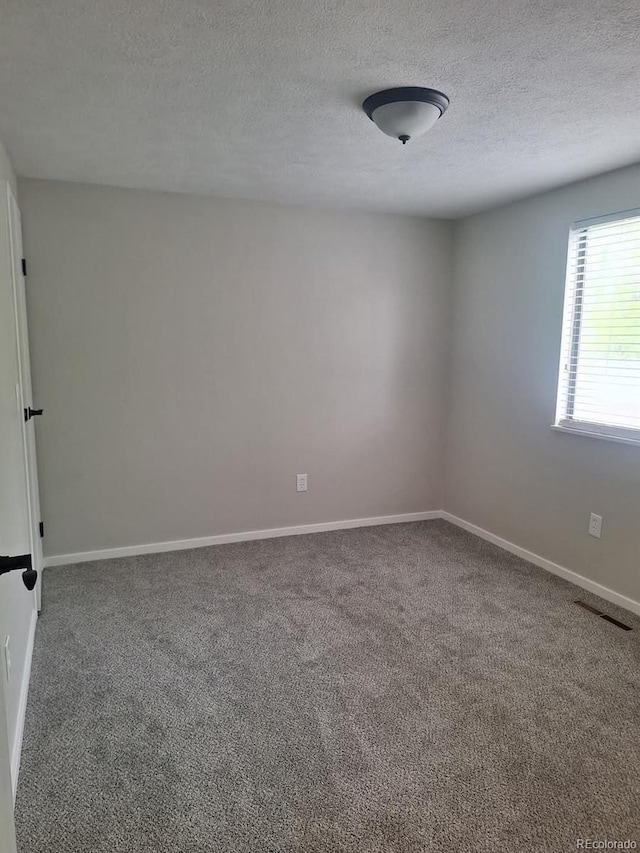 6207 W 92nd Pl, Westminster, CO 80031 - carpeted empty room with a textured ceiling