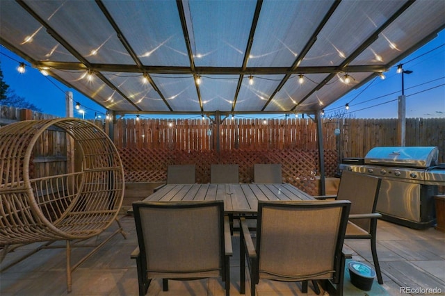 view of patio / terrace featuring area for grilling and a pergola