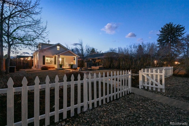 view of yard at dusk