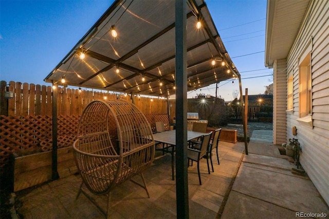 patio terrace at dusk with a pergola