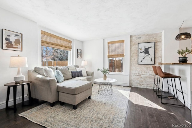 1535 Spruce St, Denver, CO 80220 - living room featuring baseboards and wood finished floors