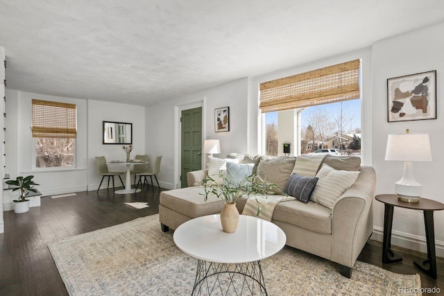 living room with baseboards and hardwood / wood-style flooring