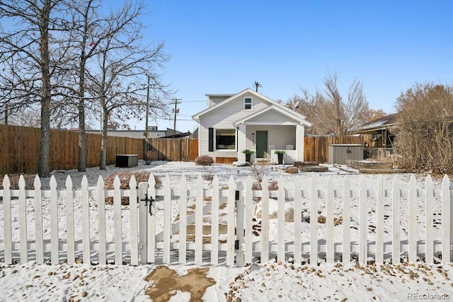 bungalow-style house featuring a gate and a fenced front yard