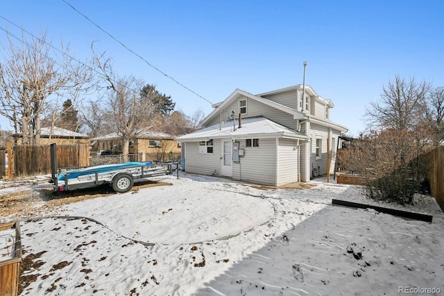 back of property with a fenced backyard