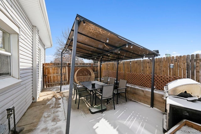 view of patio / terrace with area for grilling, outdoor dining area, and a fenced backyard
