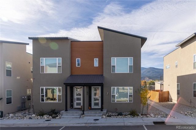 contemporary home featuring a mountain view