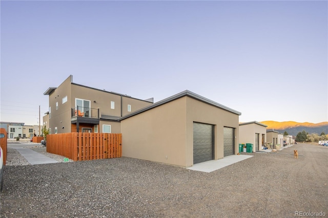 property exterior at dusk with a garage