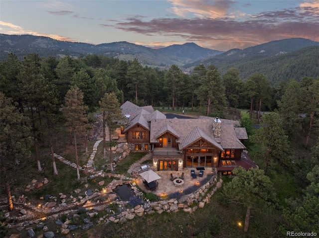 2929 Highlands View Rd, Evergreen, CO 80439 - aerial view at dusk of a forest view and a mountain view