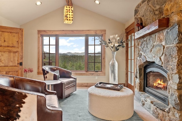 2929 Highlands View Rd, Evergreen, CO 80439 - sitting room featuring vaulted ceiling, recessed lighting, and a stone fireplace