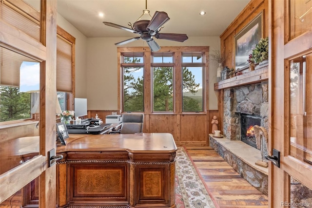 2929 Highlands View Rd, Evergreen, CO 80439 - office area with light wood finished floors, a ceiling fan, recessed lighting, a fireplace, and wooden walls