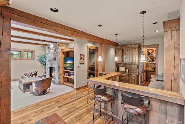 2929 Highlands View Rd, Evergreen, CO 80439 - indoor bar with light wood-type flooring, hanging light fixtures, a fireplace, and recessed lighting