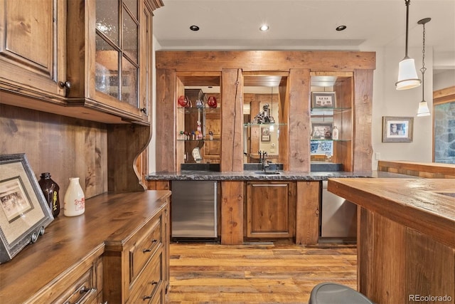 2929 Highlands View Rd, Evergreen, CO 80439 - indoor wet bar with light wood-style flooring, hanging light fixtures, refrigerator, and recessed lighting