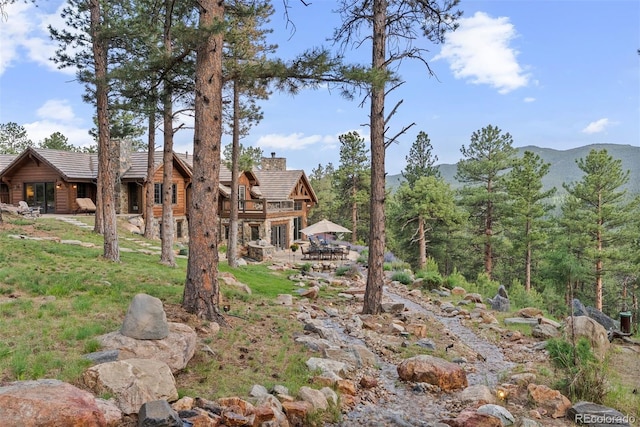 2929 Highlands View Rd, Evergreen, CO 80439 - view of yard featuring a patio and a mountain view